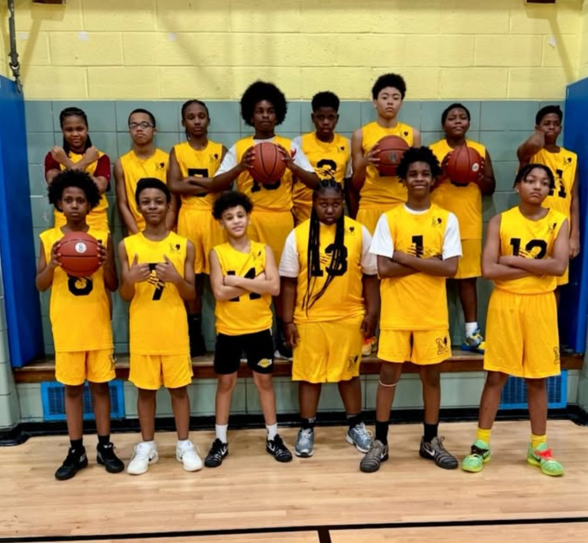 School basketball team in gold uniforms